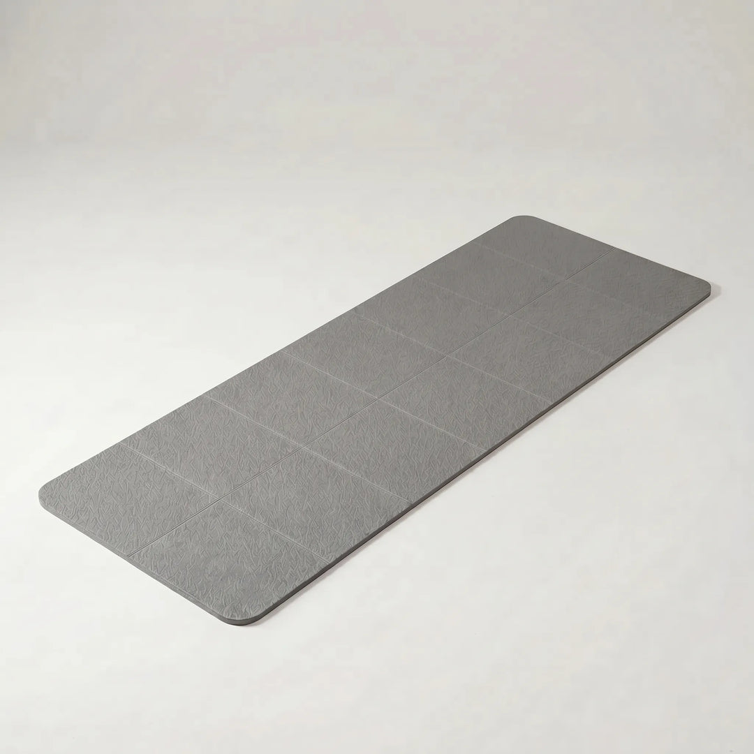Lightweight foldable TPE yoga mat, perfect for travel & easy portability. Non-slip surface for yoga, pilates & fitness.