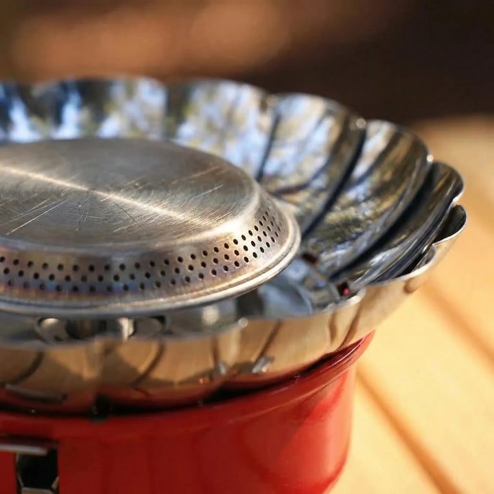 Lightweight compact folding camp stove for backpacking & outdoor cooking. Portable burner, essential hiking gear for travel.