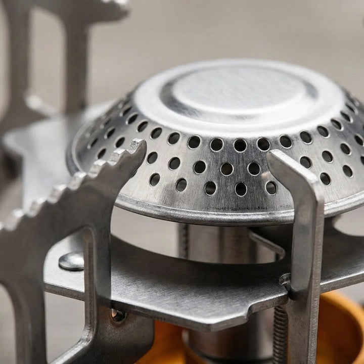 Lightweight foldable gas camping stove, essential backpacking gear for outdoor adventures.