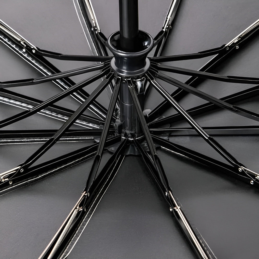 StormShield compact folding umbrella, durable UV protection for all weather, essential travel gear.