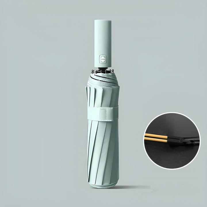 Folding travel umbrella with UV protection, compact & durable for sun and rain.