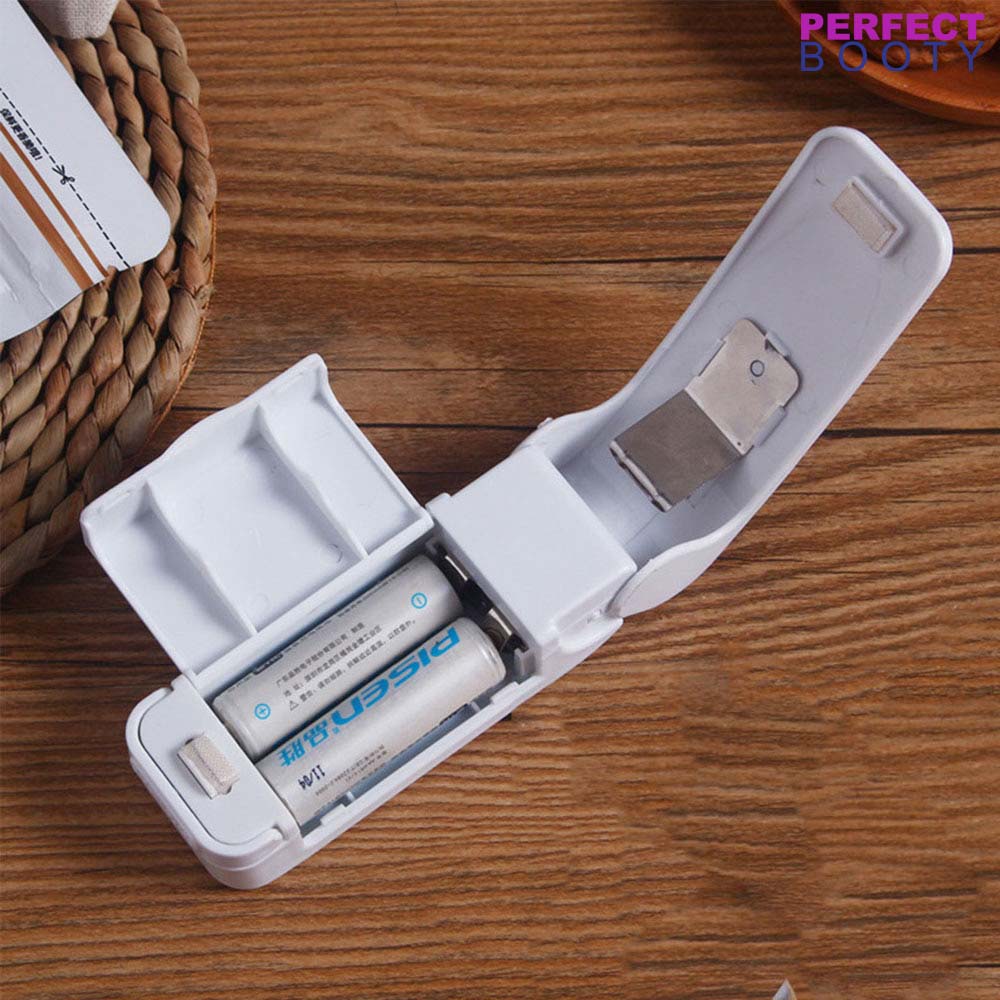 Portable food sealer in action, perfectly sealing a snack bag to keep chips crisp & fresh.