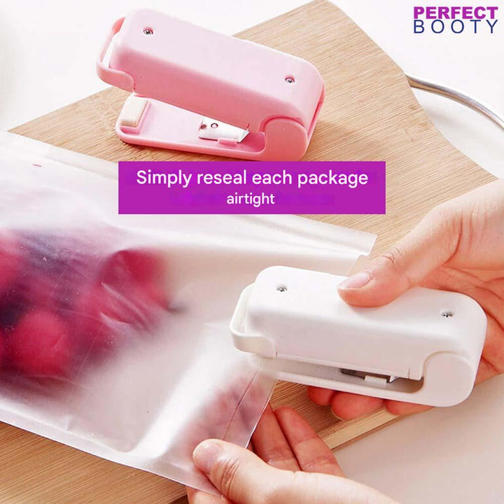 Kitchen gadget sealing a bag of vegetables, ensuring fresh produce & extended food storage life.