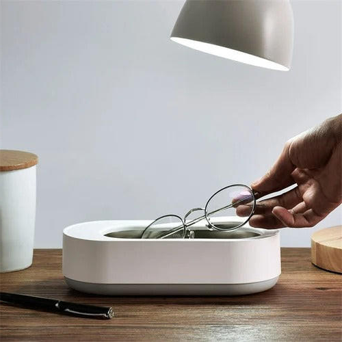Compact home ultrasonic cleaner for deep cleaning jewelry, eyeglasses, and accessories. Fast, effective personal care.