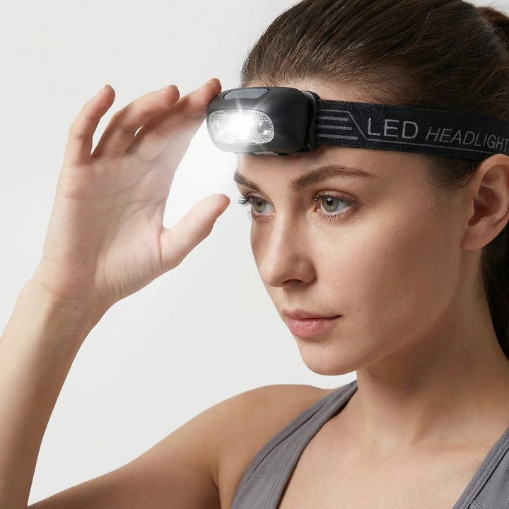 Durable LED headlamp, lightweight & rechargeable, providing essential hands-free light for outdoor enthusiasts.