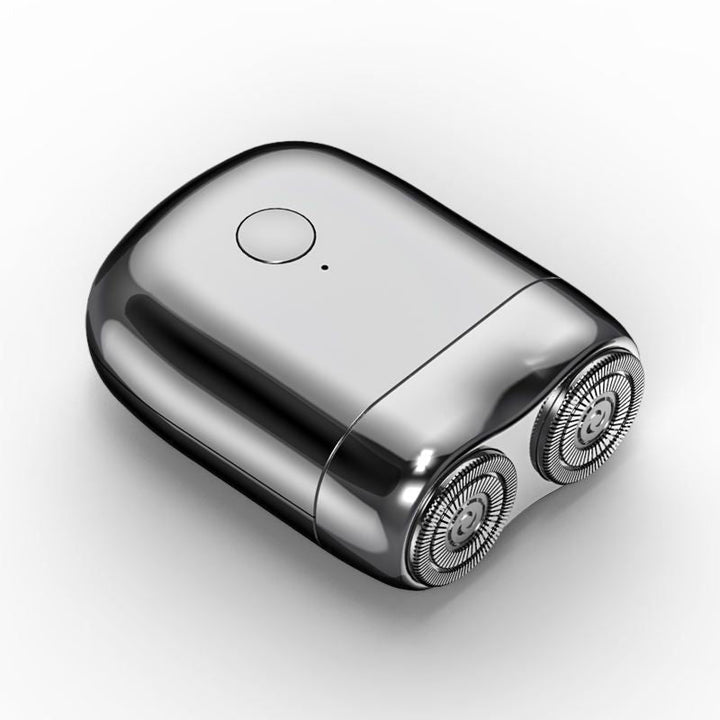 Magnetic waterproof men's electric shaver. Rechargeable mini travel razor for convenient personal care & grooming needs.