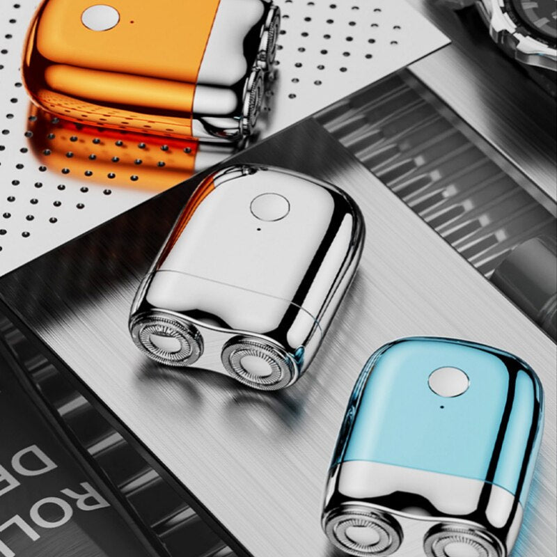 Close-up of a men's mini electric shaver: magnetic head & sleek design. Portable, rechargeable for precise personal care.