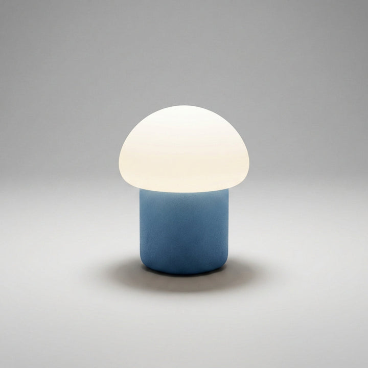 Top-down view of a Mushino compact mushroom LED lamp, highlighting its smooth, modern form.