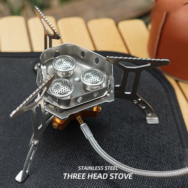 Portable gas stove for outdoor cooking. Ideal lightweight burner for camping, hiking, and travel.