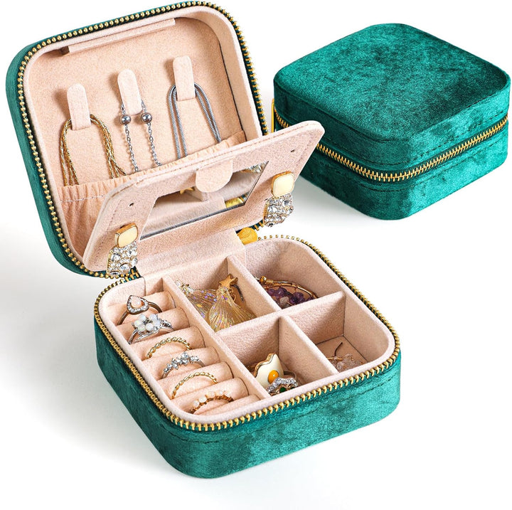 Portable blue travel jewelry organizer with mirror, a velvet case for rings, earrings, & bracelets.