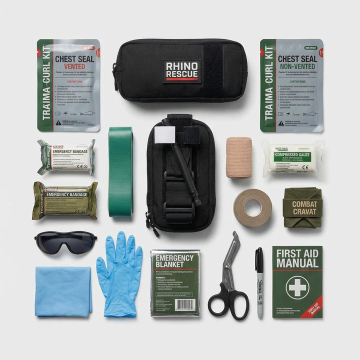 Open emergency trauma kit displaying essential medical supplies, IFAK, and survival gear for first aid.