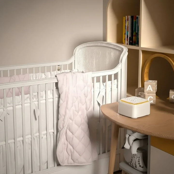 White noise sound machine, perfect nursery aid for baby sleep. Creates calming sounds for peaceful infant rest.