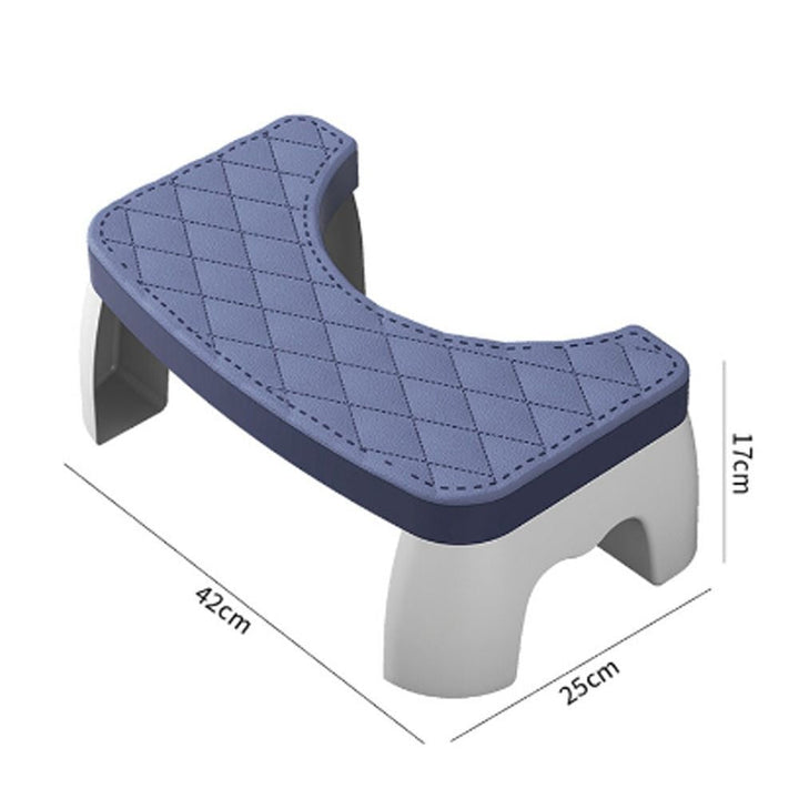 White compact non-slip plastic toilet squat stool, designed for comfortable and healthy bathroom use. Squat aid.