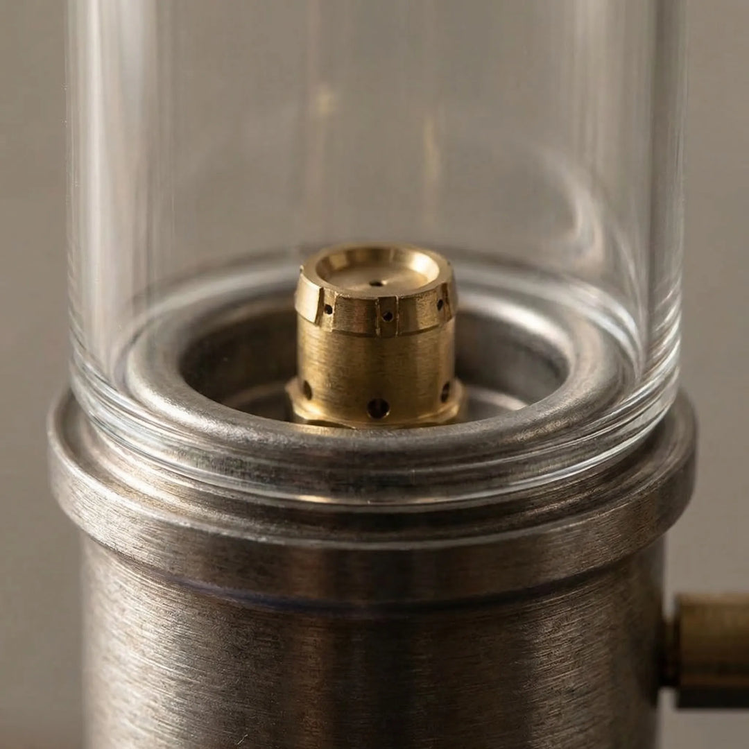 Gas camping lamp with a protective windproof design, creating a cozy candle glow for outdoor ambiance.