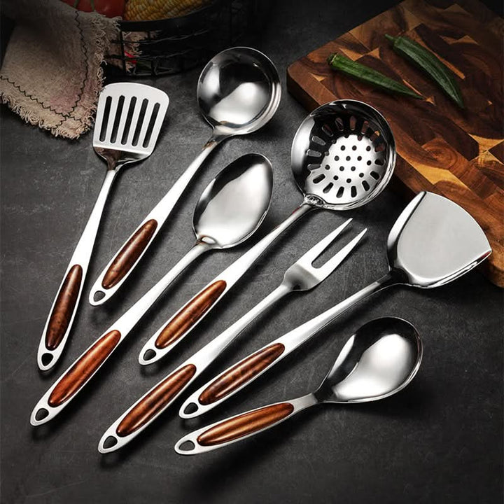 Ergonomic stainless steel kitchen tools with comfortable grip. Durable utensil set for daily home cooking.
