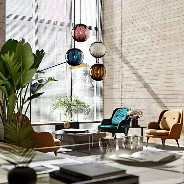 Contemporary LED glass globe pendant light for modern dining room or kitchen lighting. Energy-efficient fixture.