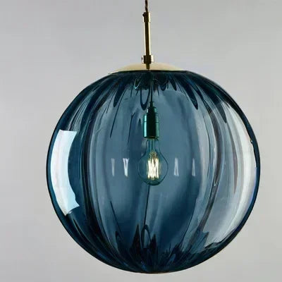 Nordic style LED pendant with a clear glass globe, a sleek and energy-efficient lighting solution.