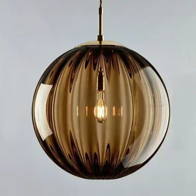 Modern LED glass globe pendant light, contemporary ceiling fixture for stylish home and loft lighting.