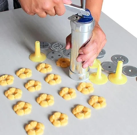 Versatile CookieCrafter cookie press, perfect for creating various cookie shapes & designs. Essential kitchen gadget for bakers.