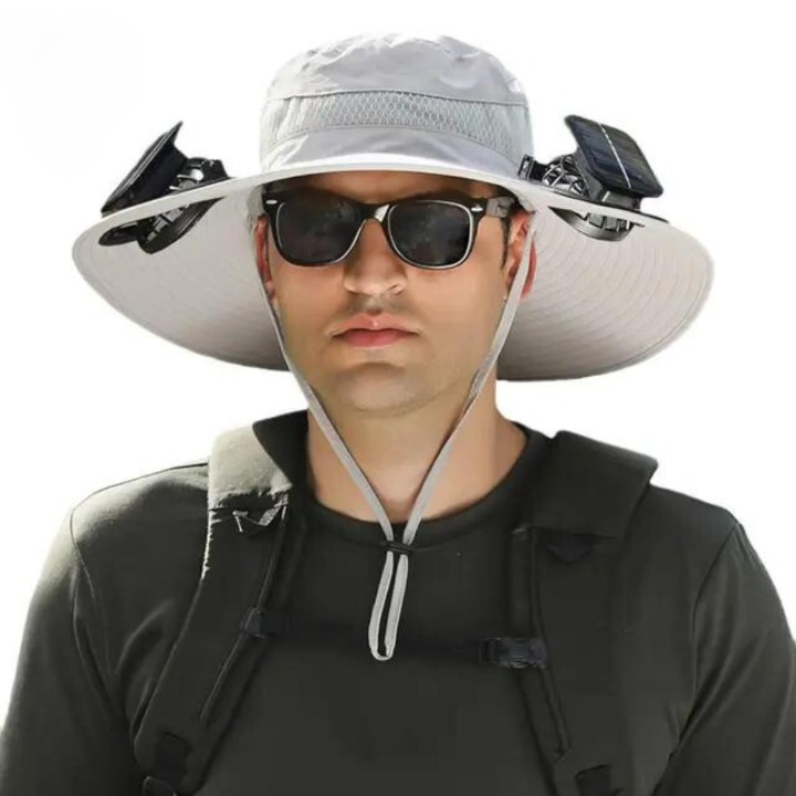 Person wearing CoolBreeze Solar Fan Hat, enjoying sun protection and cooling fan during outdoor activity