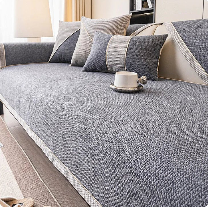Long-lasting all-season sofa cover, a durable cotton-linen protector with non-slip backing.