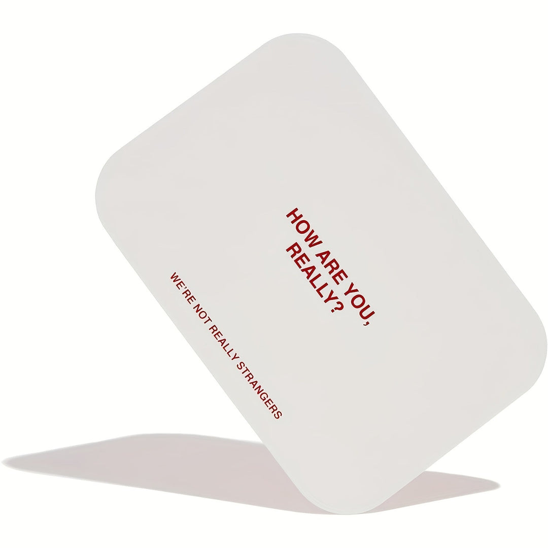 Two hands holding SoulConnect intimacy cards, fostering emotional connection for partners.