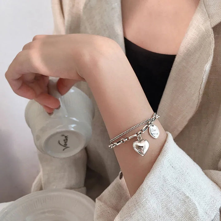 Adjustable stainless steel love bracelets for couples. Matching duo jewelry, a romantic relationship gift set.