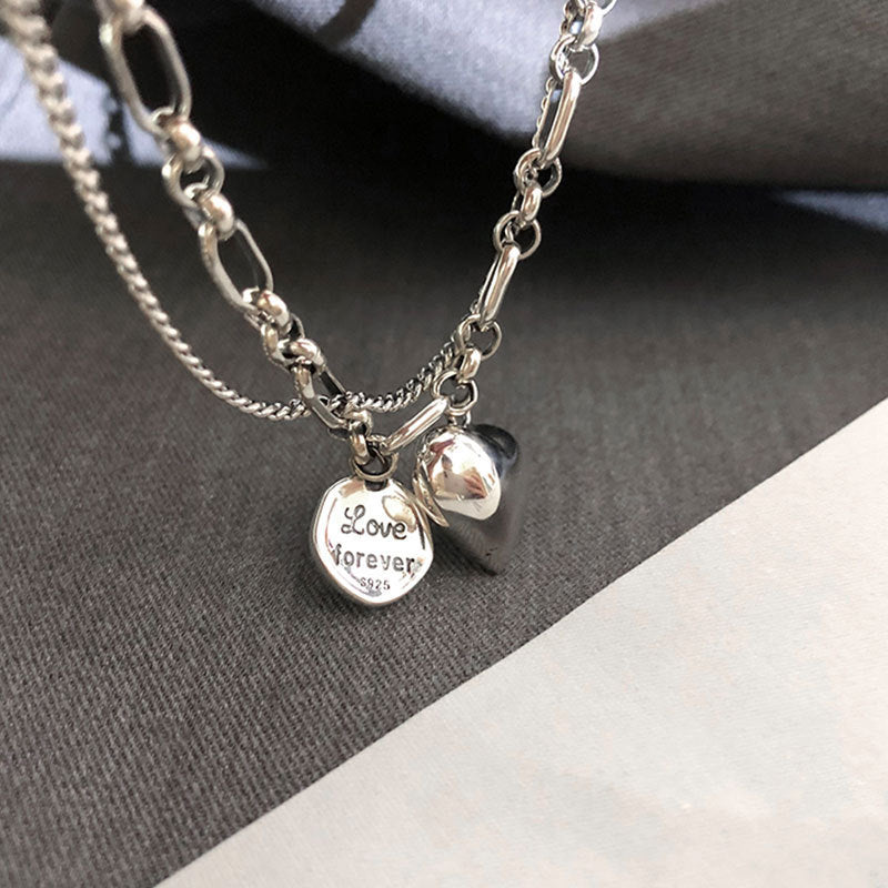 A couple showcasing their adjustable stainless steel love bracelets. Matching romantic duo jewelry for relationships.