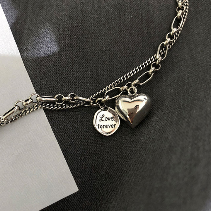 Elegant presentation of the Couples' Romantic Duo Love Bracelet Set. Adjustable matching stainless steel gift jewelry.
