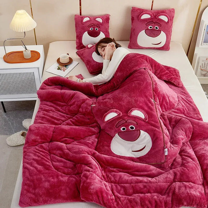 Plush blanket and cartoon cushion set. Soft fleece for bedroom or sofa.