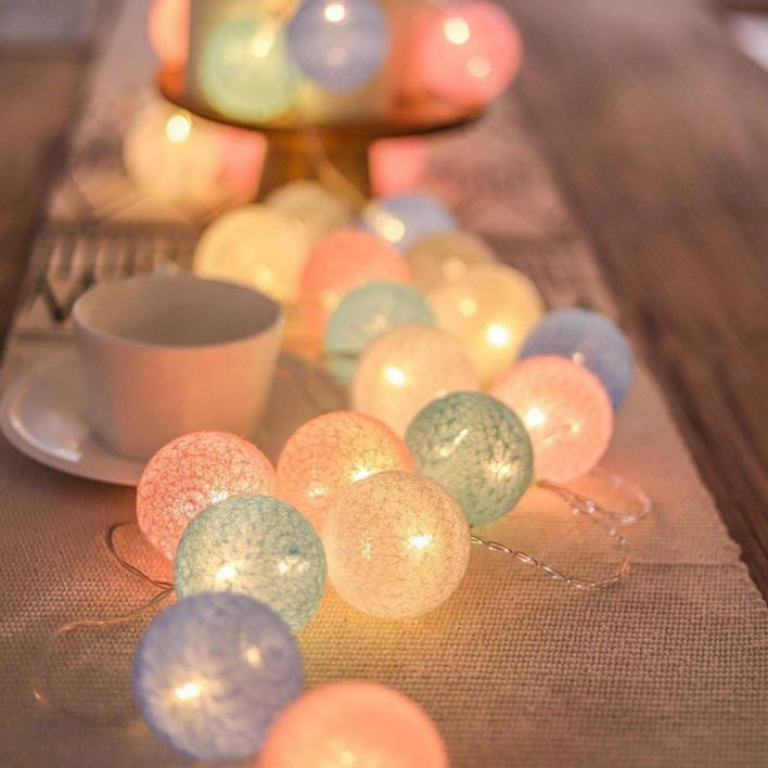 Battery-operated cotton ball fairy lights for flexible, portable party & home decorations.