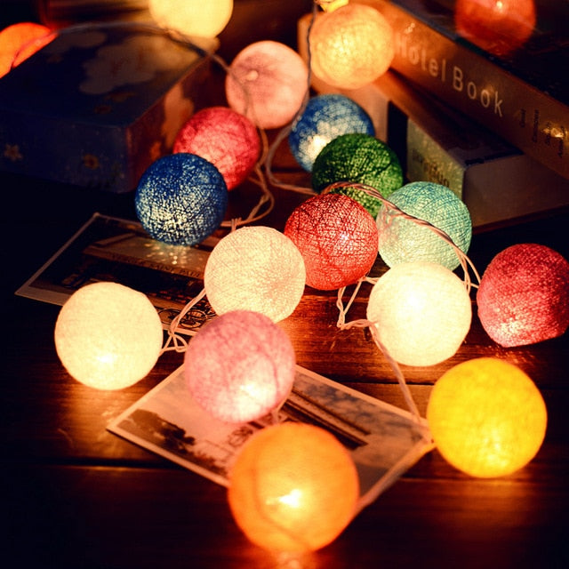 Elegant white cotton ball lights, ideal mood lighting for bedroom or living room decor.