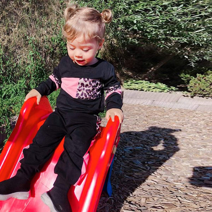 Essential cotton sweater and trouser set for baby girls' layering.