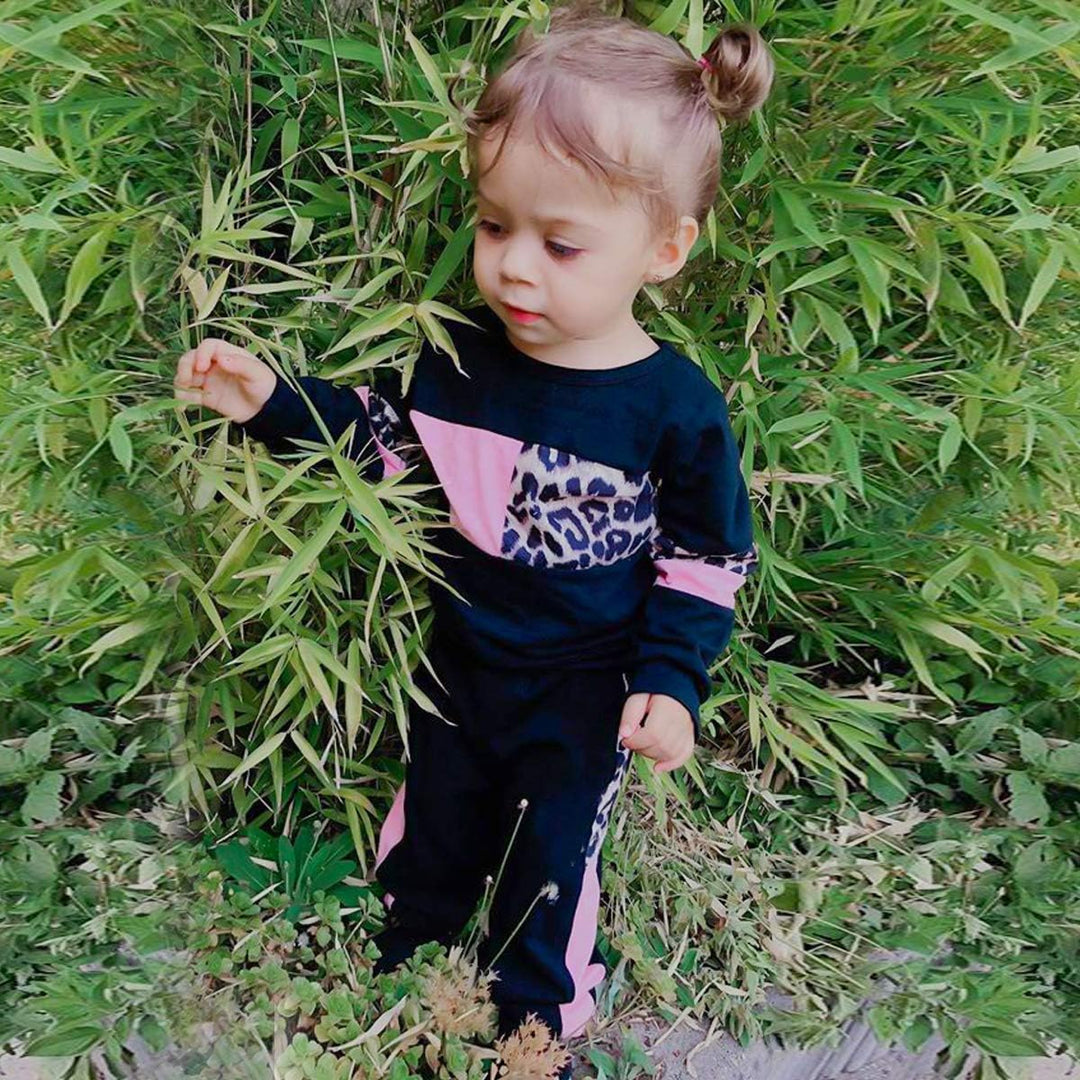 Warm girls' cotton sweater with ribbed cuffs and matching trousers.