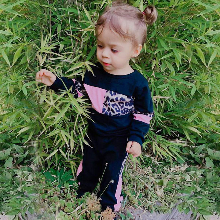 Warm girls' cotton sweater with ribbed cuffs and matching trousers.