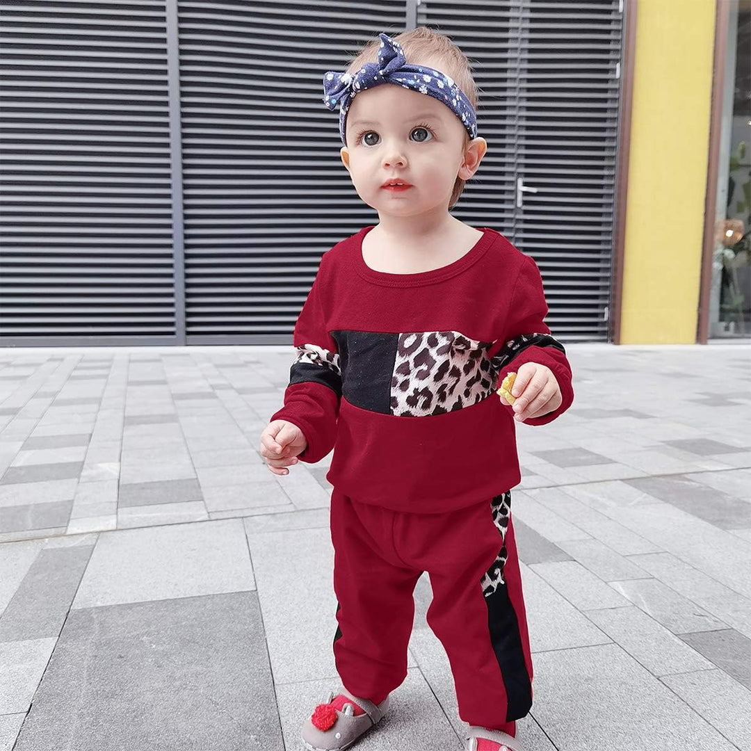 Girls' natural cotton sweater and trouser set, gentle and soft.