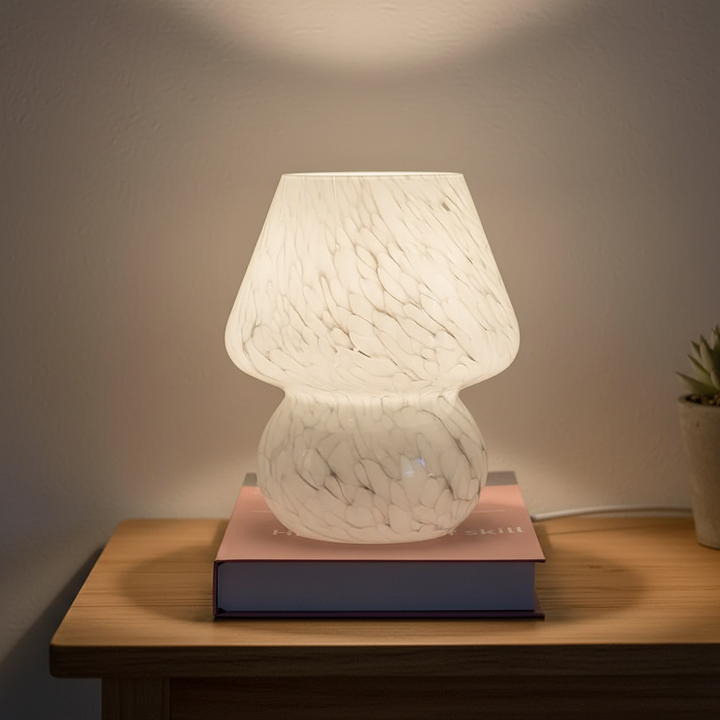 Cozy glass mushroom table lamp for home decor. Warm ambient light, unique design.