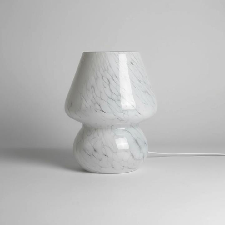 AuraShroom glass mushroom lamp, perfect bedside table decor. Emits warm, cozy light.