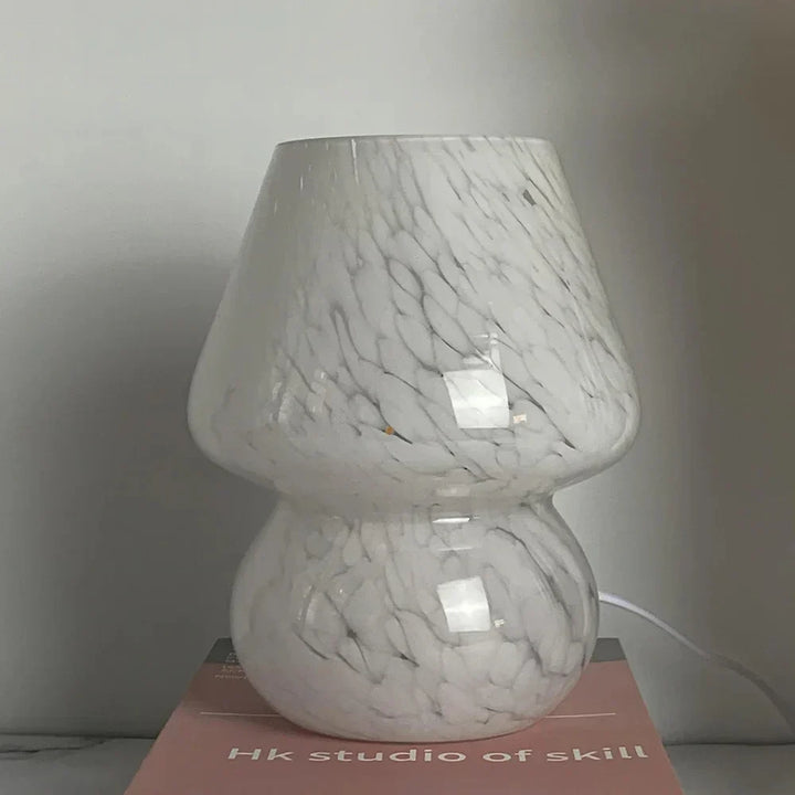 Elegant glass mushroom table lamp, ideal for cozy bedroom or living room decor. Warm glow.