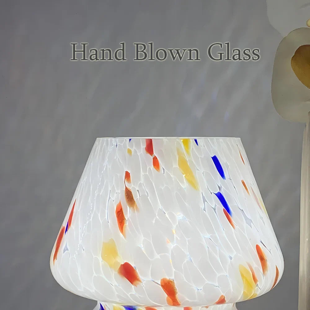 Modern glass mushroom table lamp, a charming addition to home decor. Warm and inviting light.