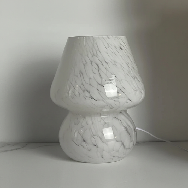 Handcrafted glass mushroom lamp, perfect for decorative home lighting. Warm, soothing glow.
