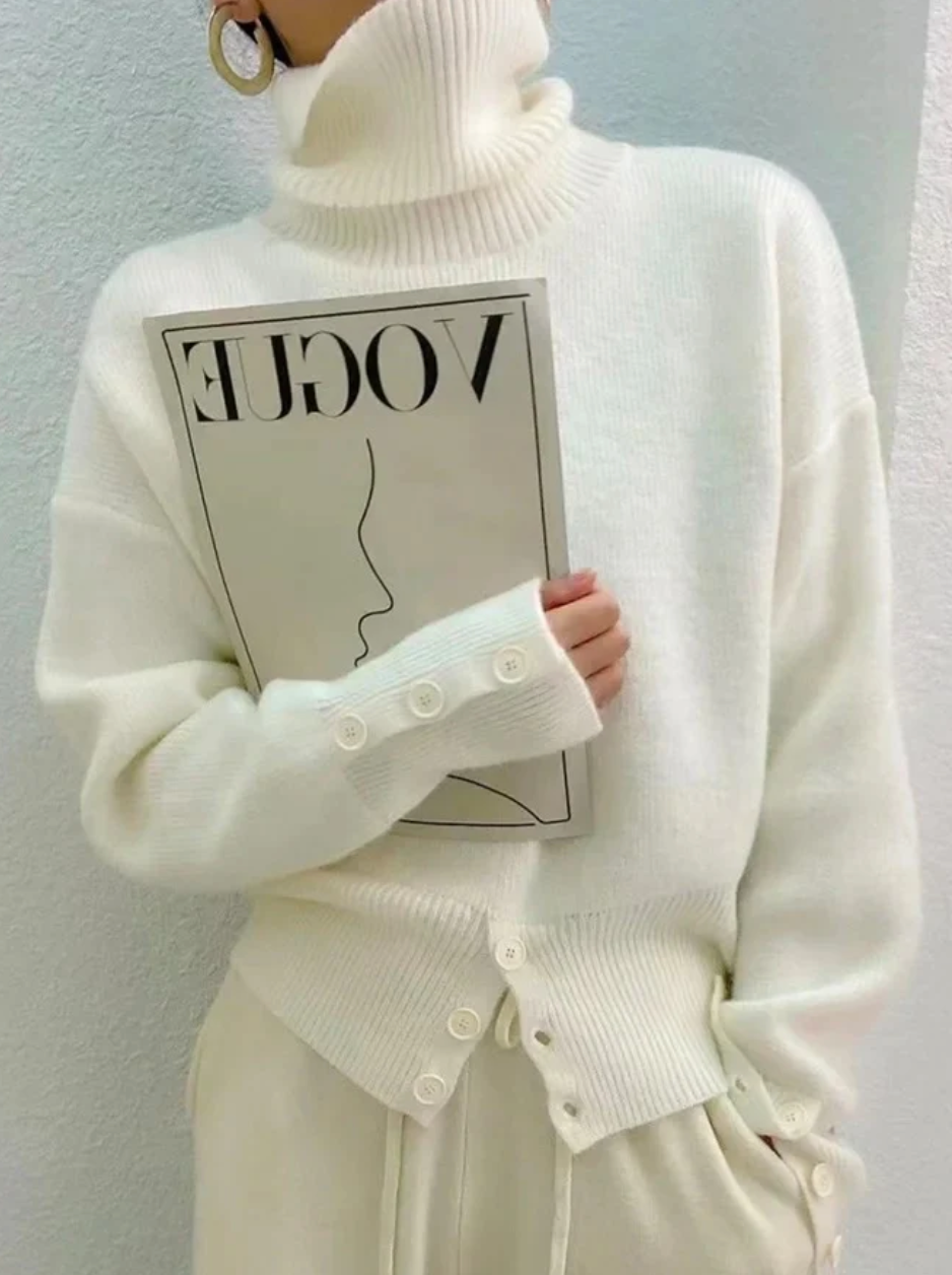 Chic women's ivory turtleneck sweater, a plain knit fall essential with long sleeves for casual winter style.