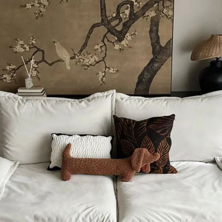 Unique Dachshund accent pillow, long, soft boucle, cozy animal-shaped home decor.
