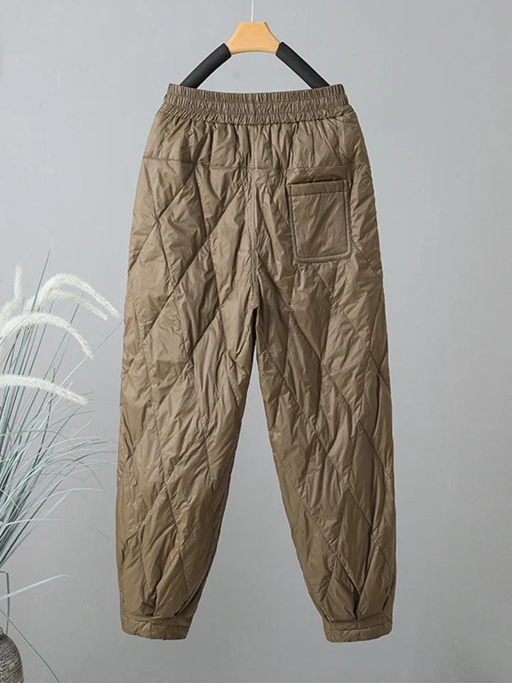 Warm women's quilted pants, ideal for winter & everyday comfort. Stylish, casual, and cozy with pockets.