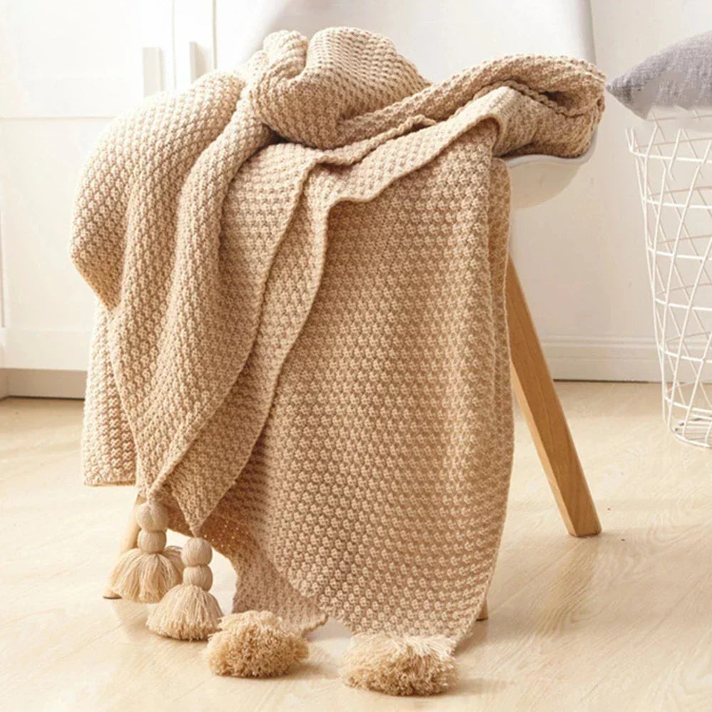 Stylish Scandinavian wool knitted blanket, Aurora, adding a cozy and decorative touch.
