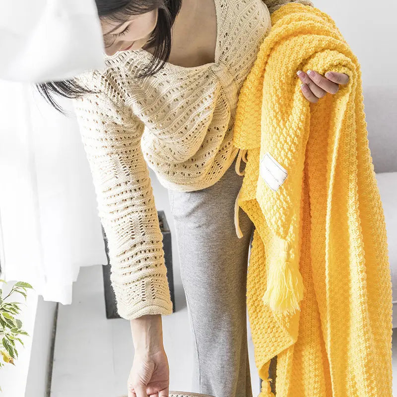Authentic Scandinavian knitted wool throw, Aurora, for a truly cozy and stylish living area.