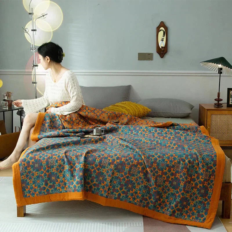 Cozy six-layer cotton quilt in vibrant orange and blue pattern for bedroom decor