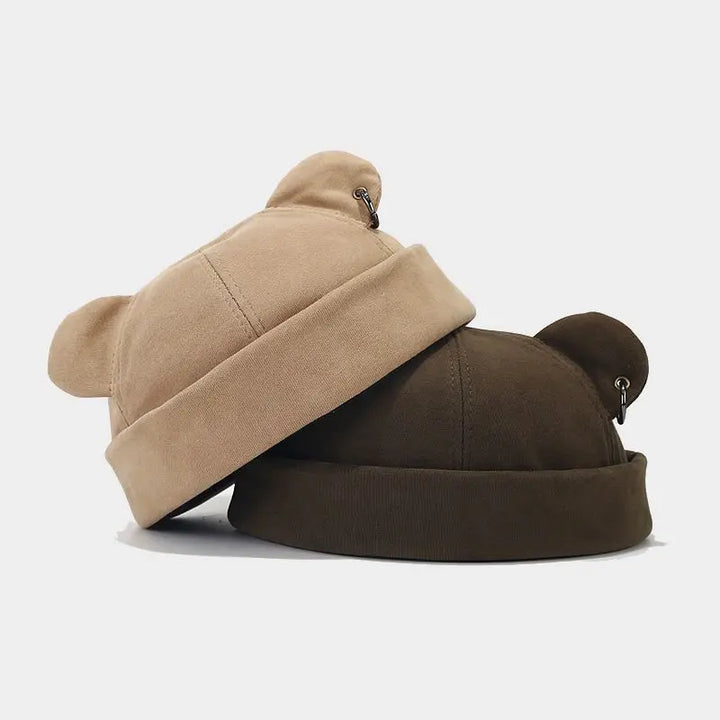 Cozy unisex bear ears beanie hat in soft knit. Perfect playful winter accessory for warmth and fashion.