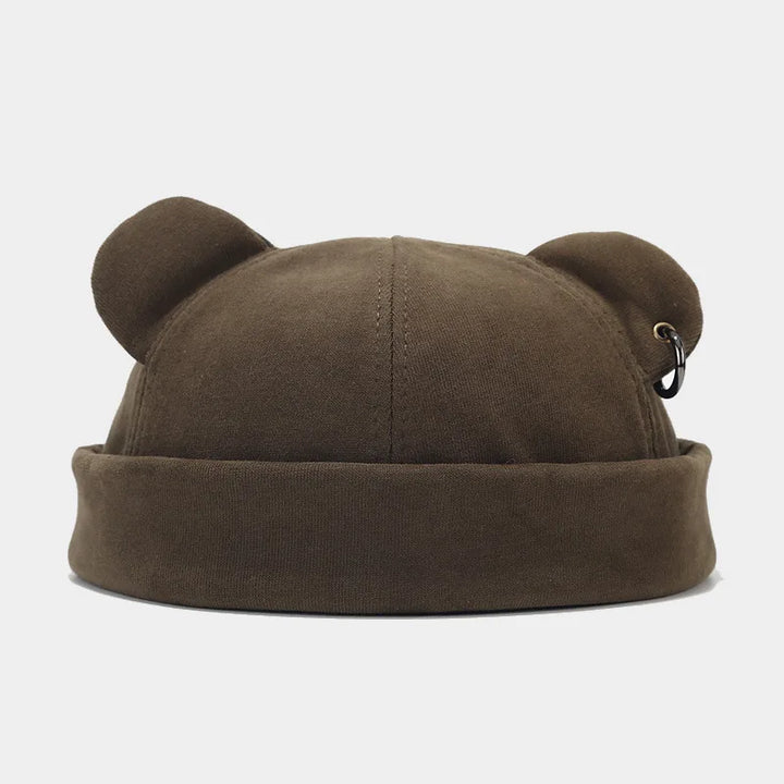 Playful unisex winter hat featuring cozy bear ears. This soft knit beanie is a fun accessory for all ages.