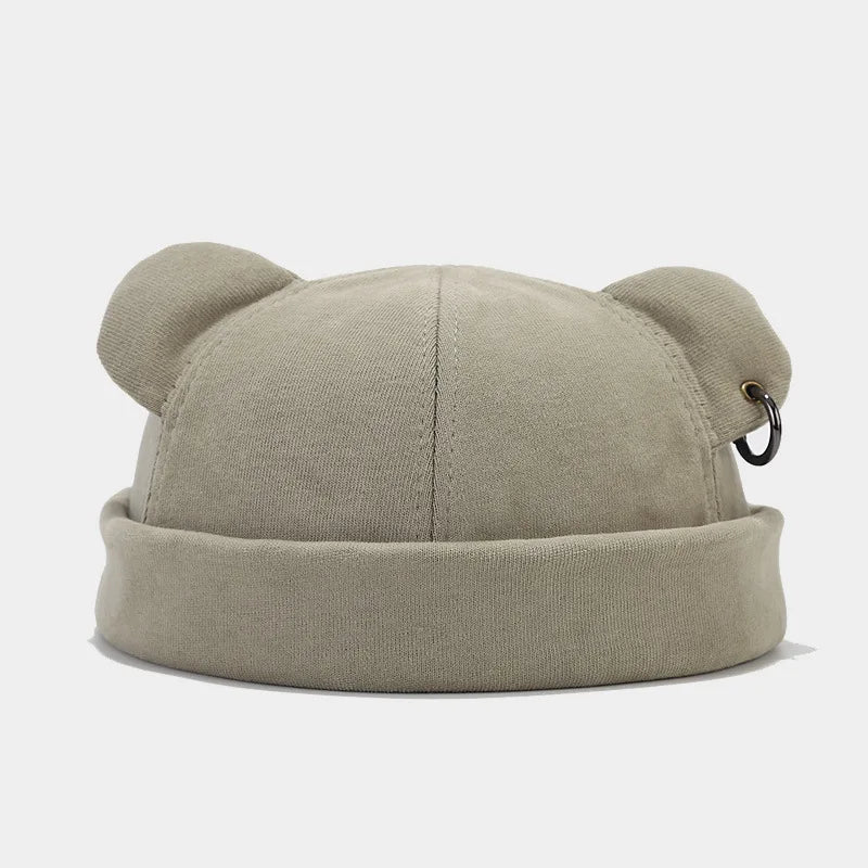 Stylish soft knit unisex beanie with playful bear ears. A cozy and fashionable winter hat accessory.